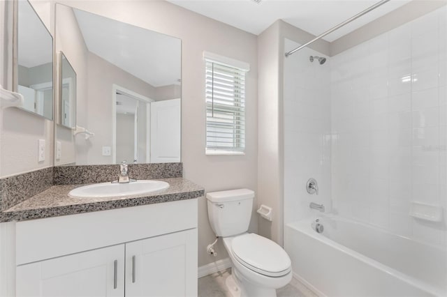 full bathroom with vanity, toilet, and tiled shower / bath