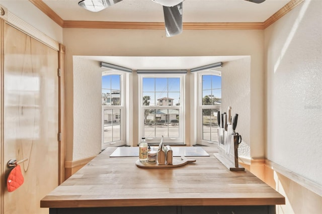 dining space with ornamental molding