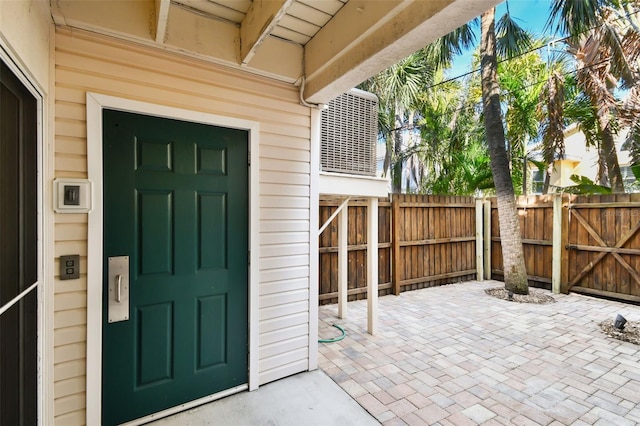 doorway to property featuring cooling unit