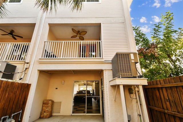 exterior space with ceiling fan, a patio area, a balcony, and central air condition unit