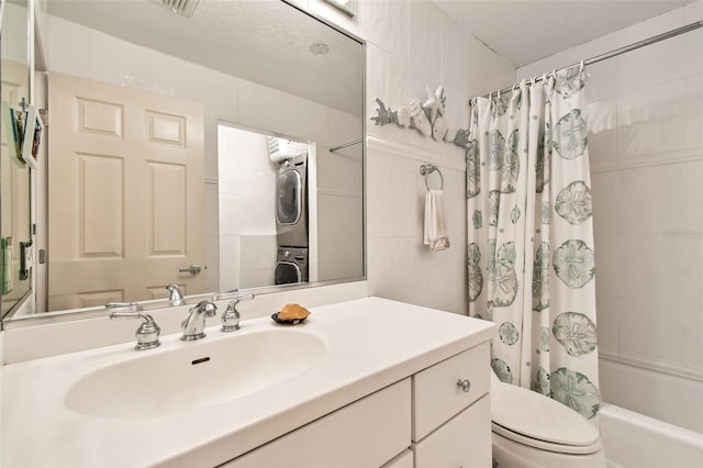 full bathroom with vanity, shower / tub combo, toilet, and stacked washing maching and dryer