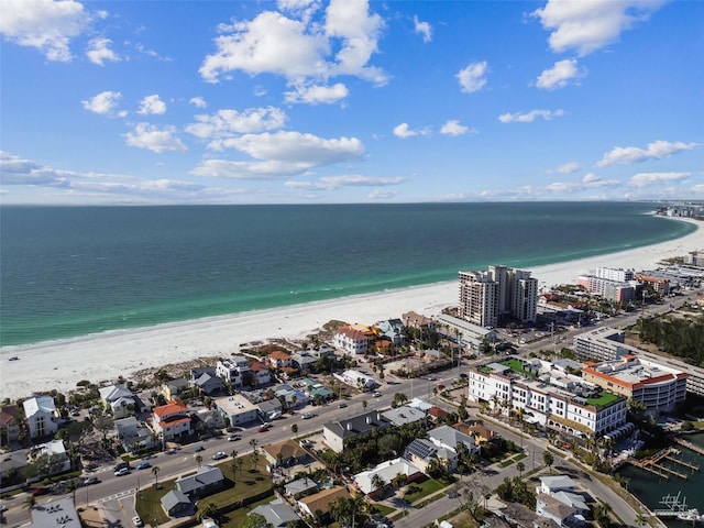 drone / aerial view featuring a water view and a view of the beach