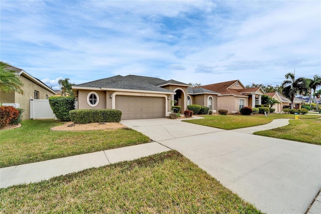 single story home featuring a garage and a front lawn