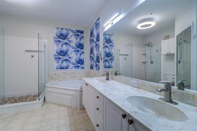 full bathroom featuring shower with separate bathtub, vanity, tile patterned floors, and toilet