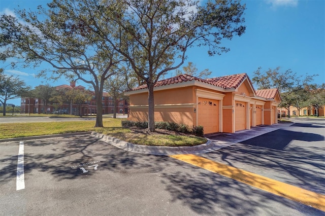 view of side of property with a garage