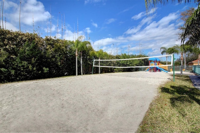 surrounding community with a playground and volleyball court