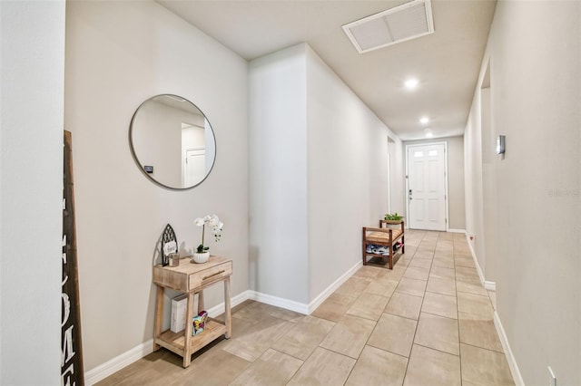 foyer featuring light tile patterned floors