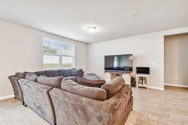 living room with a textured ceiling