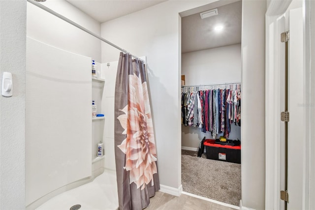 bathroom featuring walk in shower