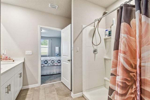 bathroom featuring vanity and a shower with shower curtain