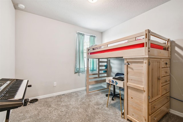 bedroom with carpet flooring and a textured ceiling