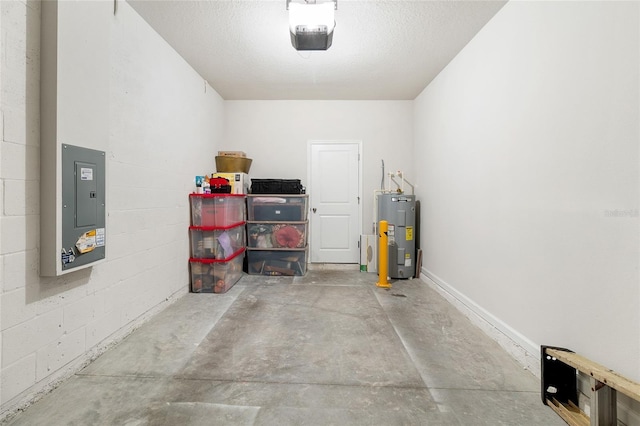 garage with water heater, a garage door opener, and electric panel