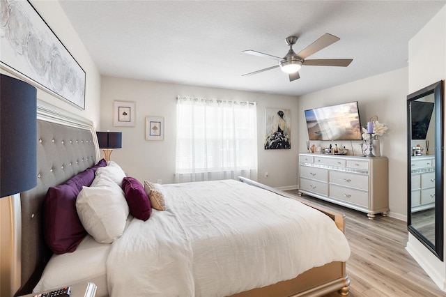 bedroom featuring ceiling fan and light hardwood / wood-style flooring