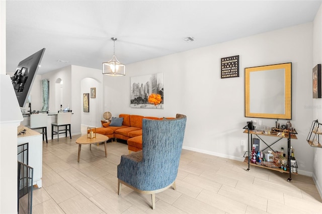 living room featuring an inviting chandelier