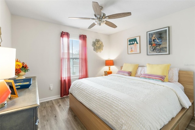 bedroom featuring light hardwood / wood-style floors and ceiling fan