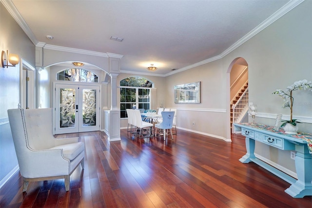 dining room with ornamental molding, dark wood-type flooring, and french doors