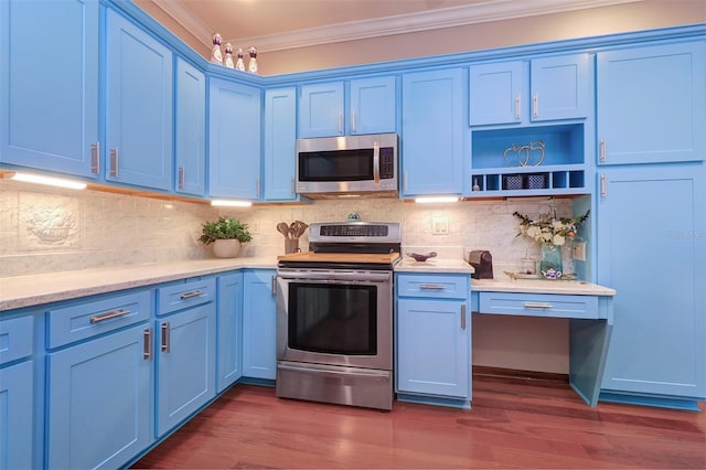 kitchen featuring ornamental molding, appliances with stainless steel finishes, and blue cabinets