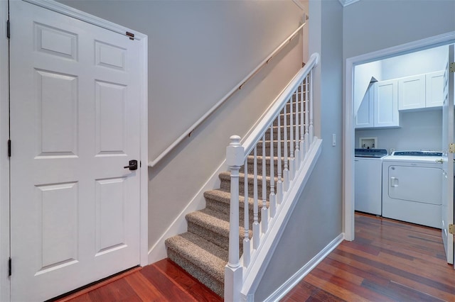 stairway featuring washer and dryer and hardwood / wood-style floors