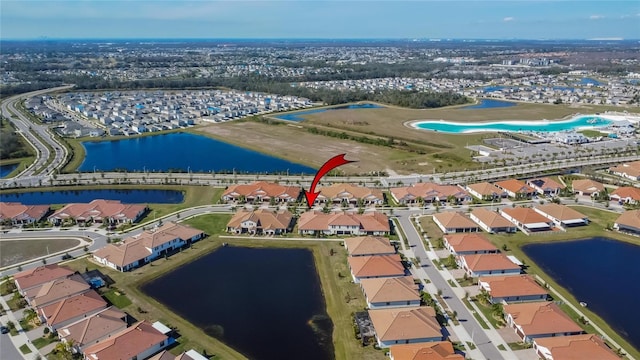 birds eye view of property featuring a water view