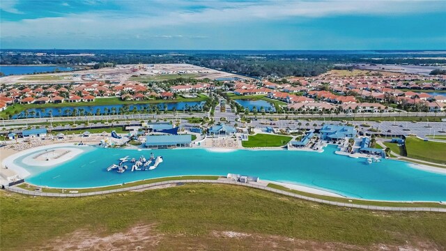 bird's eye view with a water view and a beach view