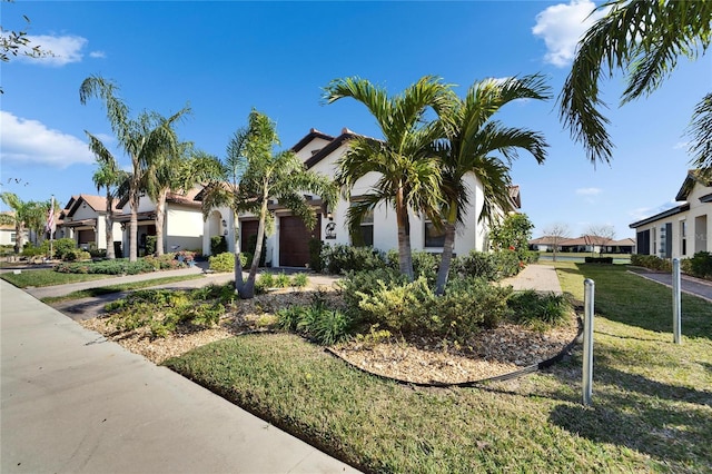 mediterranean / spanish home featuring a front yard