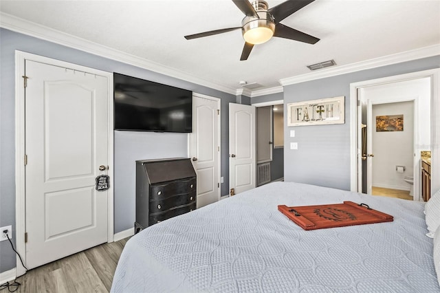 bedroom featuring ceiling fan, ornamental molding, and light hardwood / wood-style flooring