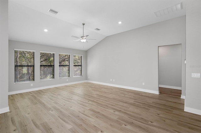 unfurnished room with lofted ceiling, light hardwood / wood-style floors, and ceiling fan