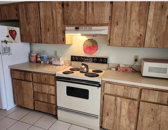 kitchen with white appliances and light tile patterned flooring