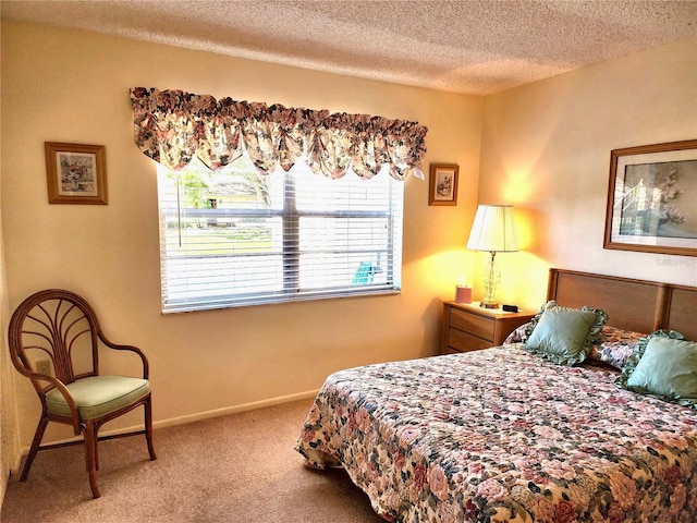 carpeted bedroom featuring a textured ceiling