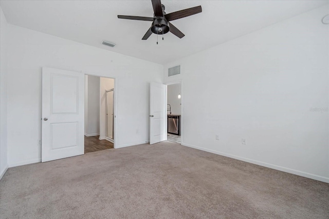 unfurnished bedroom featuring ceiling fan and light colored carpet