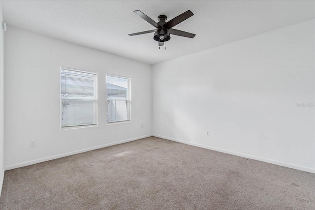 unfurnished room featuring carpet floors, a textured ceiling, and ceiling fan