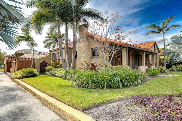 view of side of home featuring a yard