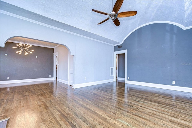 unfurnished living room with vaulted ceiling, ceiling fan with notable chandelier, hardwood / wood-style floors, and a textured ceiling