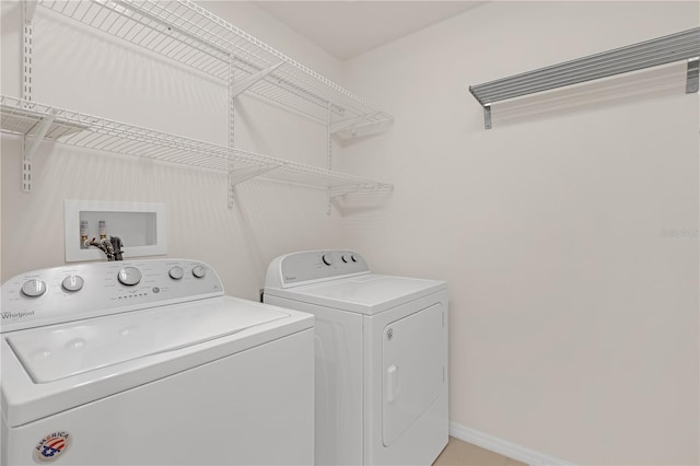 laundry area with independent washer and dryer