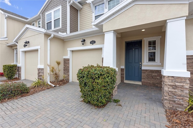 view of exterior entry featuring a garage