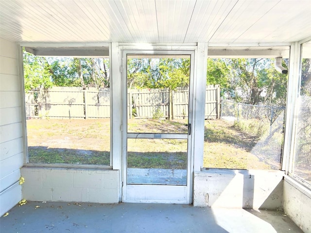 unfurnished sunroom with a healthy amount of sunlight