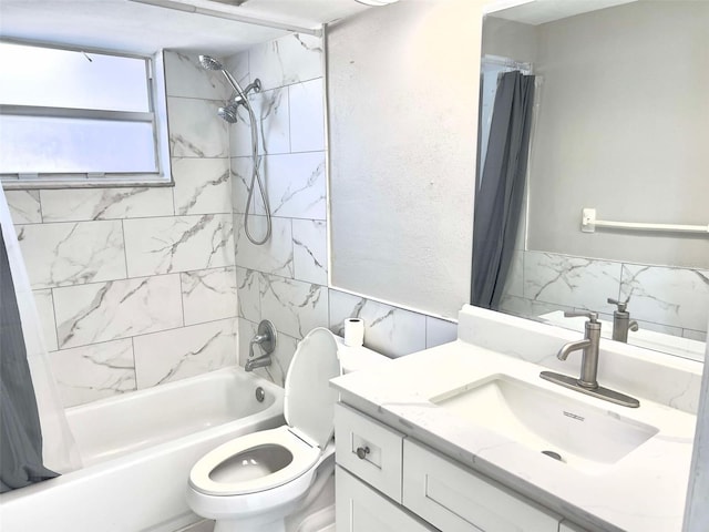 full bathroom featuring vanity, shower / tub combo with curtain, and toilet