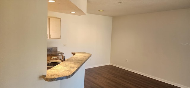 office space with sink and dark hardwood / wood-style floors