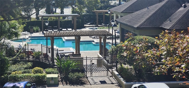 view of swimming pool featuring a pergola and a patio area