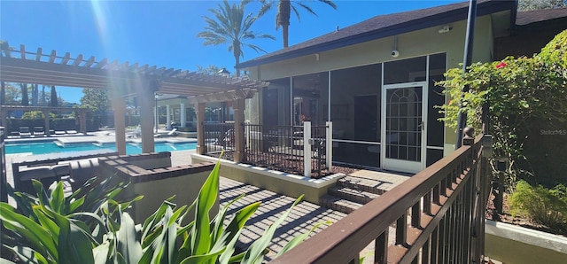 exterior space featuring a pergola and a sunroom