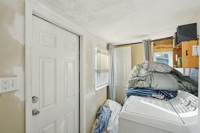 bedroom featuring washer / dryer