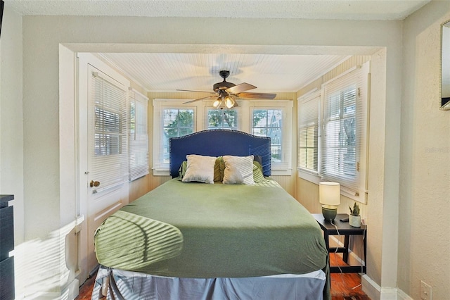 bedroom with hardwood / wood-style floors and ceiling fan