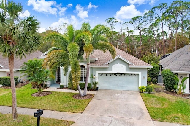 view of front of home featuring a garage and a front yard