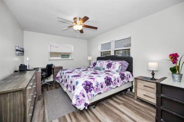 bedroom featuring wood-type flooring and ceiling fan