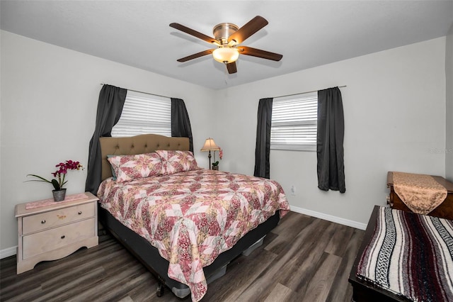 bedroom with ceiling fan and dark hardwood / wood-style floors