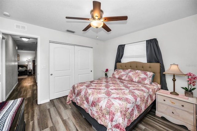 bedroom featuring dark hardwood / wood-style flooring, a closet, and ceiling fan