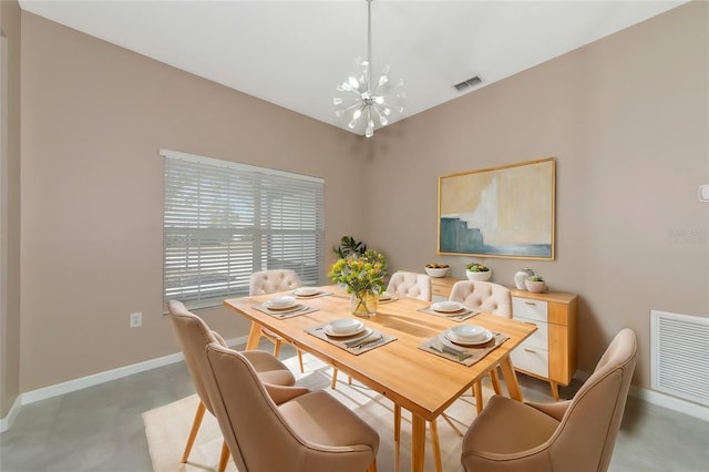 dining space featuring a notable chandelier