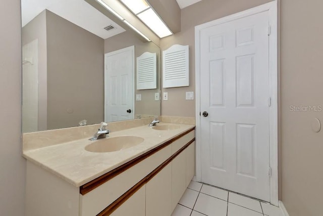 bathroom with vanity and tile patterned floors