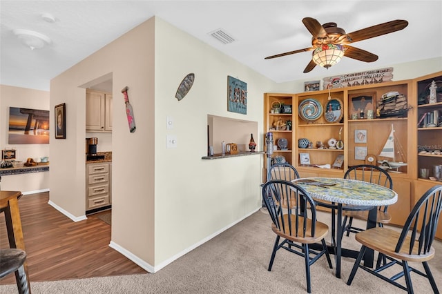 dining room featuring ceiling fan and wood-type flooring