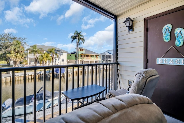 balcony featuring a water view